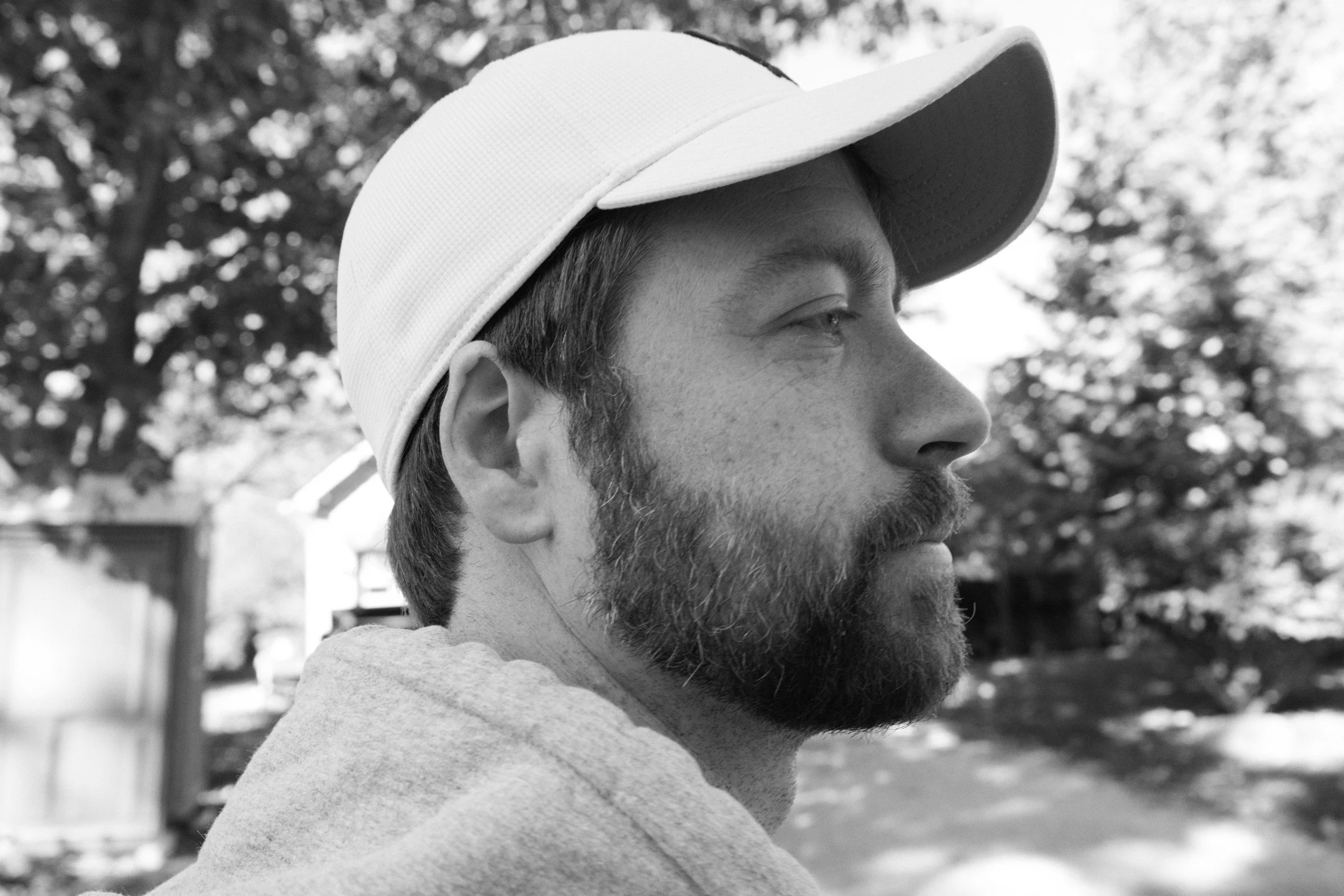 Noah Livingston outdoors in profile, looking off-frame